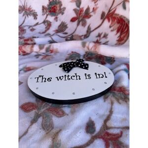 The Witch Is In Hangable Sign